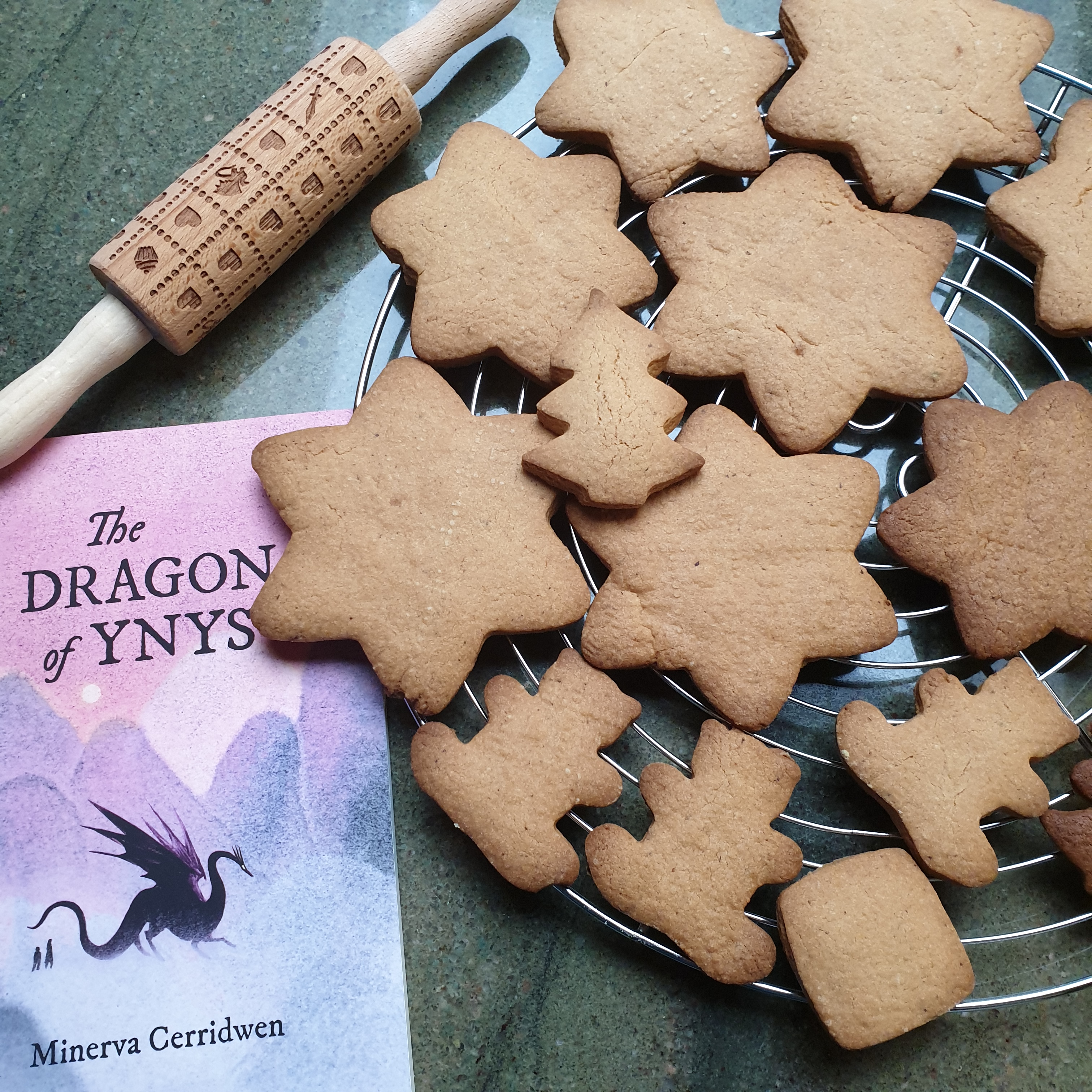 Baked biscuits, the rolling pin, and a copy of "The Dragon of Ynys".