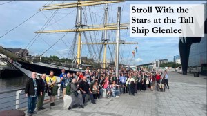 Photo of a group of people in front of the Tall Ship Glenlee.
