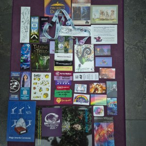 Photo of lots of cards around a convention badge